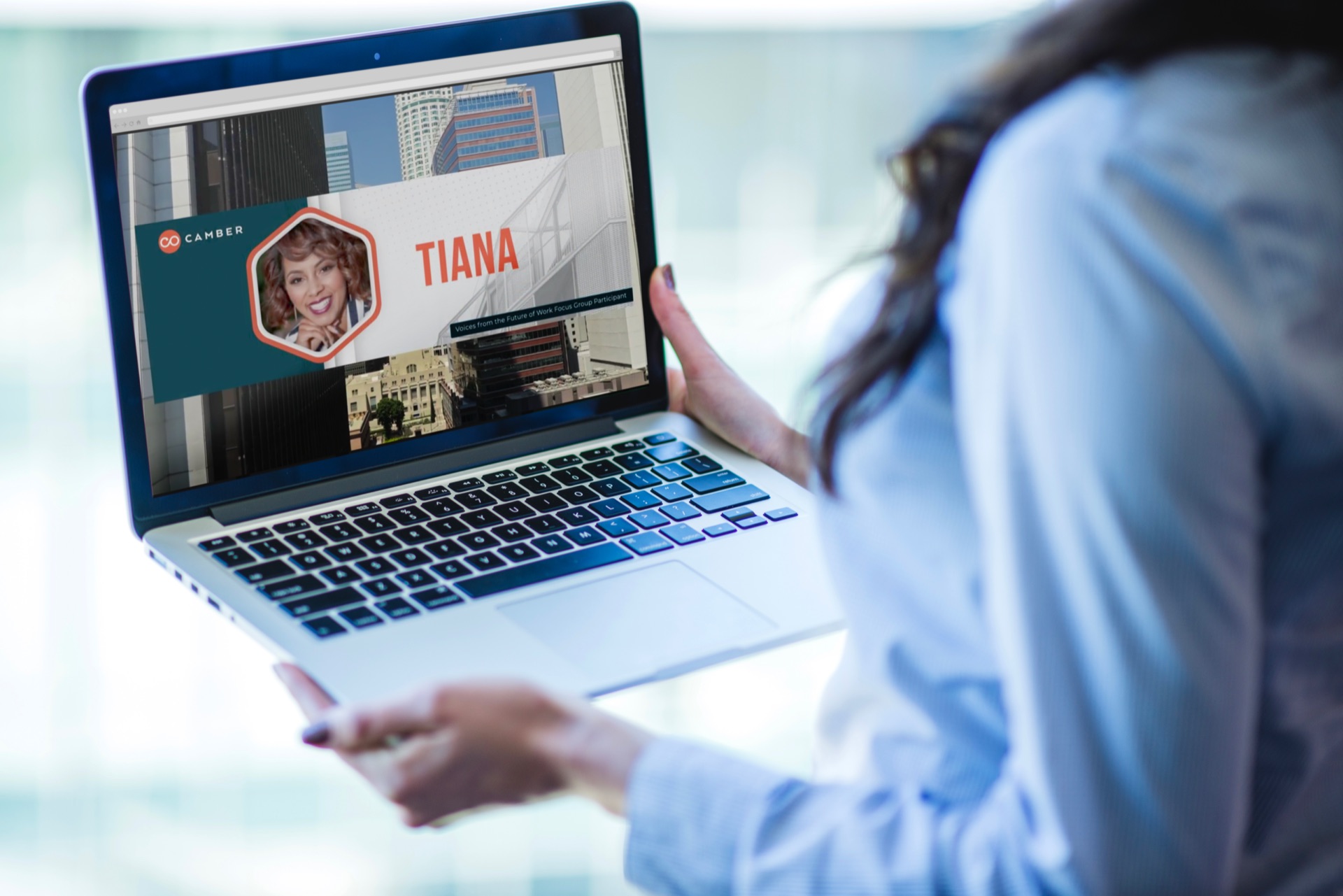 Woman viewing Camber Outdoors video portfolio on laptop
